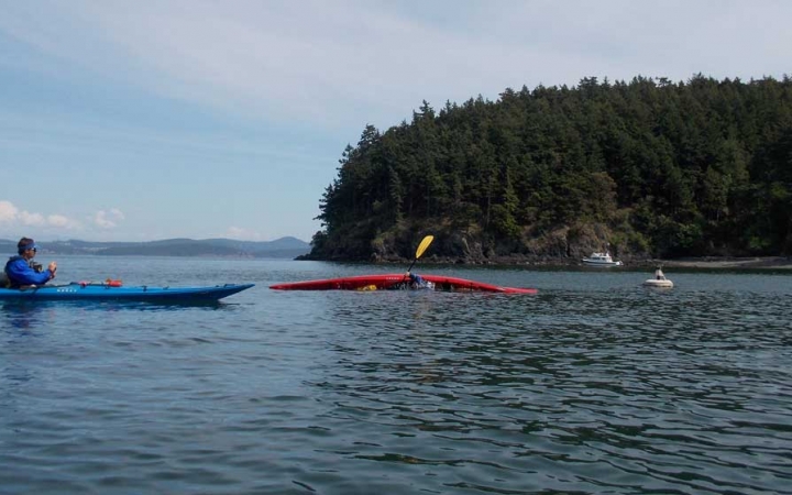 adults sea kayaking in san juan islands